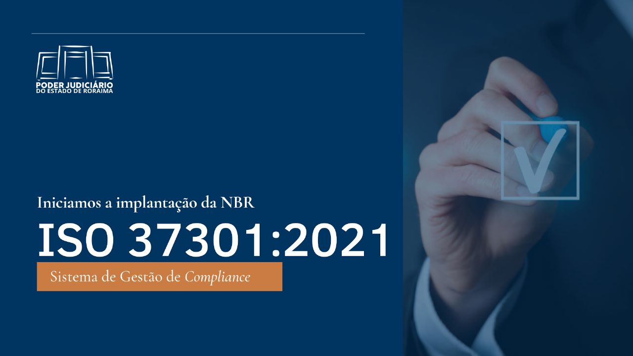 Card colorido com fundo azul marinho mostra ao lado direito a imagem de uma mão segurando um pincel e desenhando uma seta de confirmação. Ao lado esquerdo está a foto “Iniciamos a implantação da NBR ISO 37301:2021. Sistema de Gestão de Compliance”. No canto superior esquerdo está a logomarca do Poder Judiciário de Roraima.