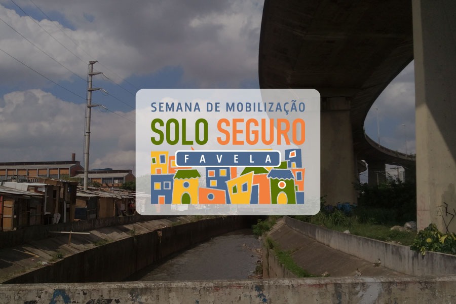 Imagem coloridade das ruas de uma cidade. No centro o texto: Semana de Mobilização Solo Seguro Favela